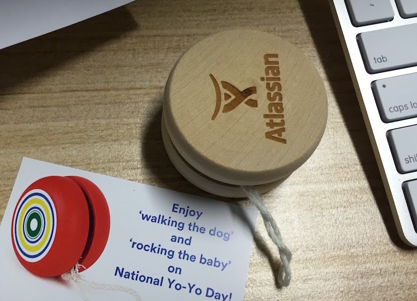 A yo-yo I received from Atlassian. Card next to it says walk the dog and rock the baby.