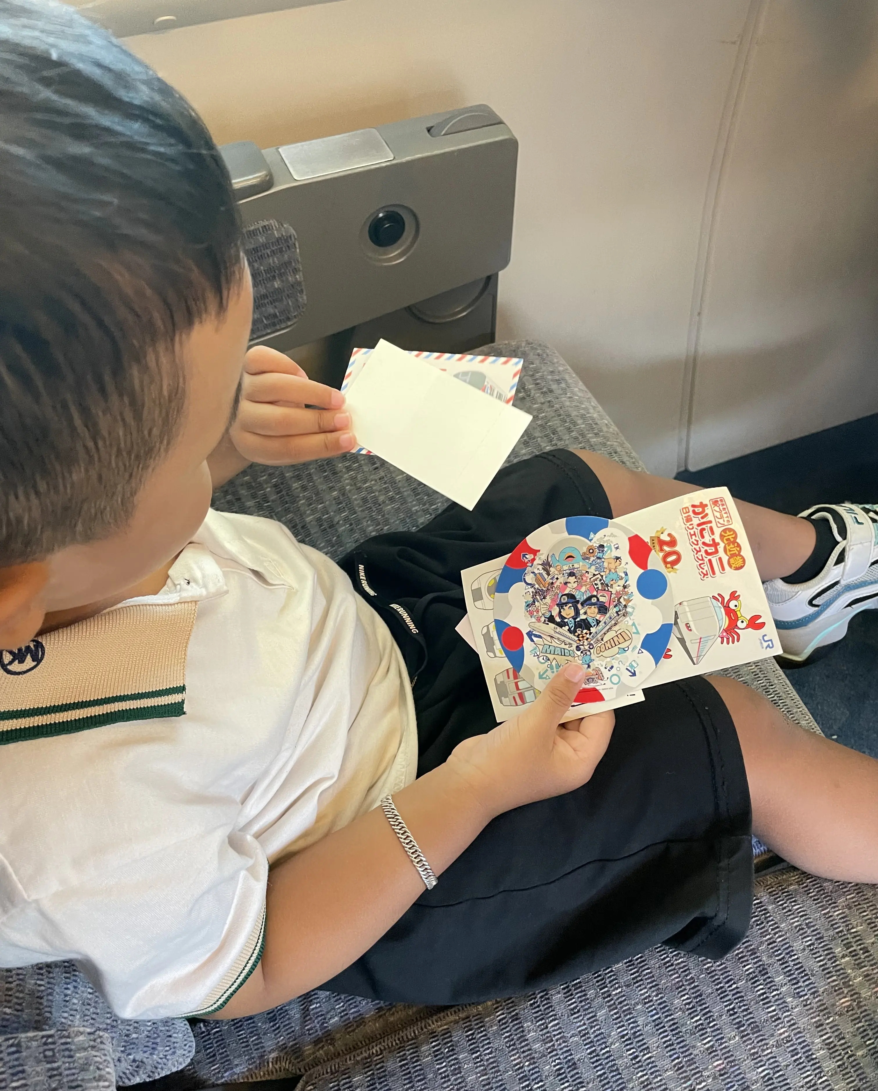 With his collection of train stickers